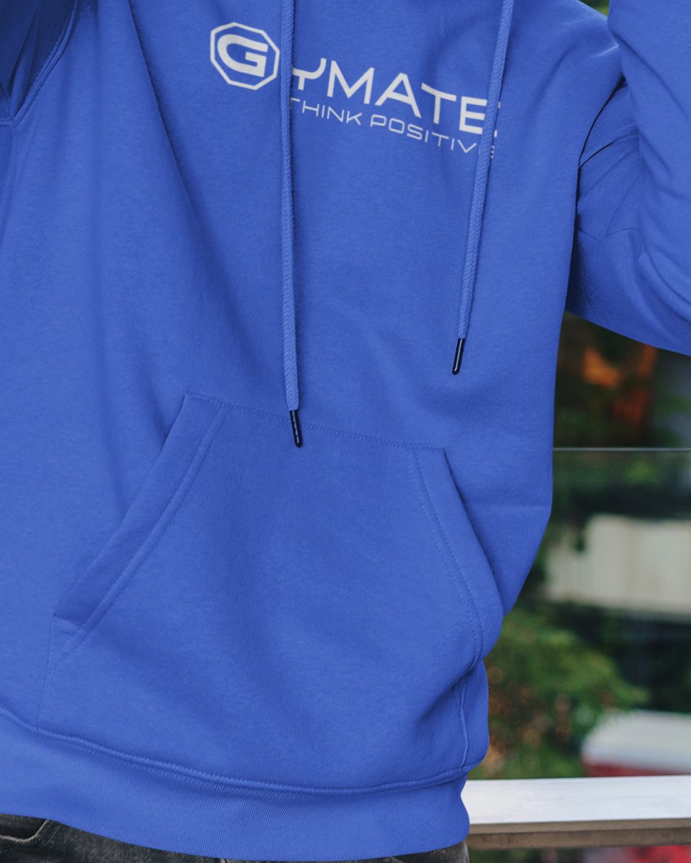 Men’s light blue designer hoodie with centre ‘Think Positive’ logo close up of kangaroo pockets