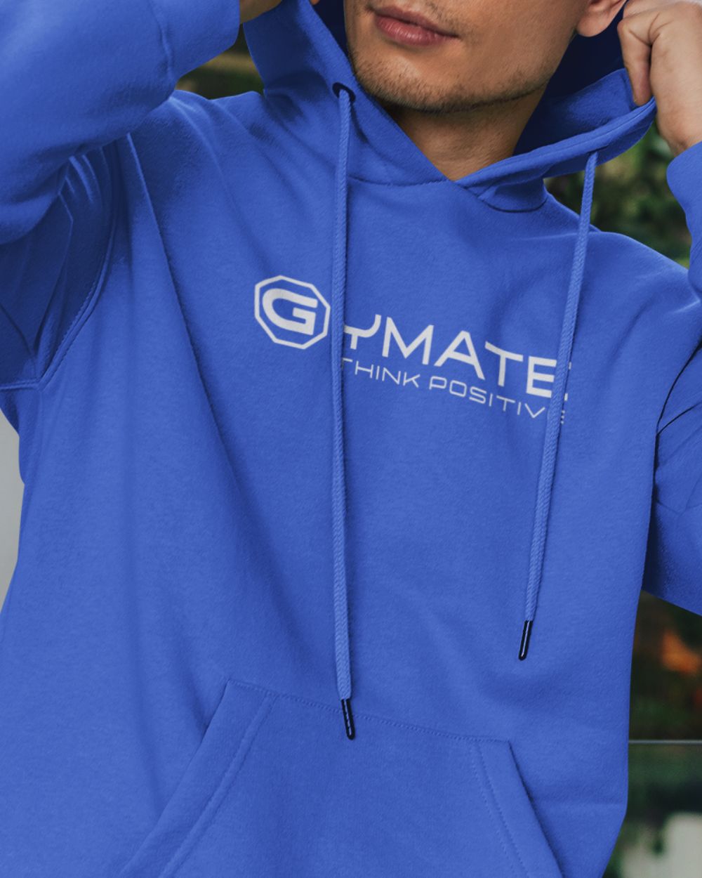Men’s light blue designer hoodie with centre ‘Think Positive’ logo close up view