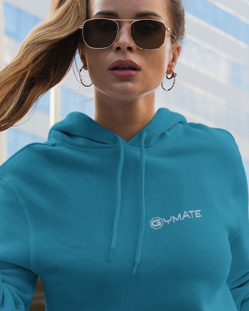 sapphire blue womens designer hoodie with gymate logo on chest