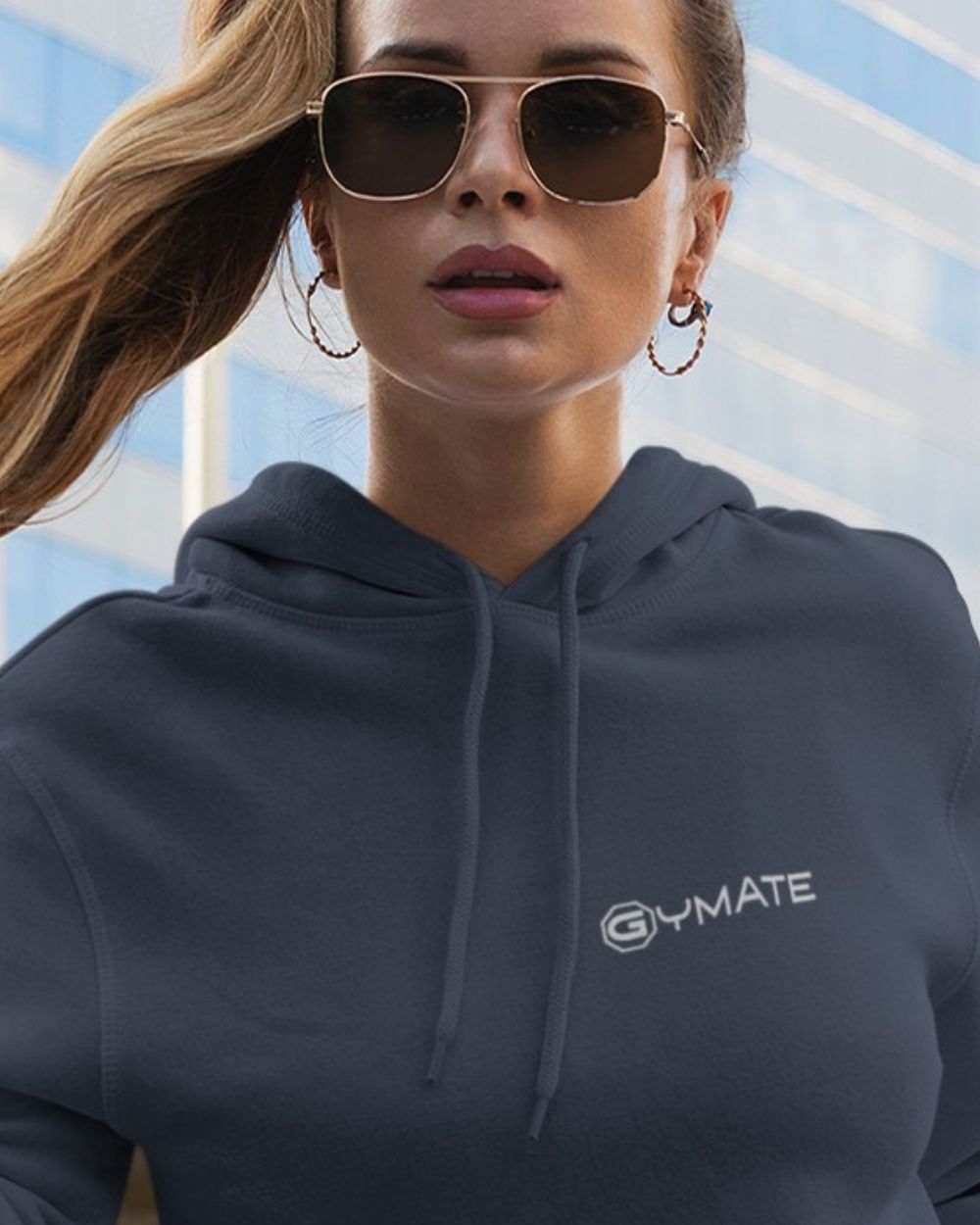 airforce blue womens designer hoodie with close up of gymate logo on chest