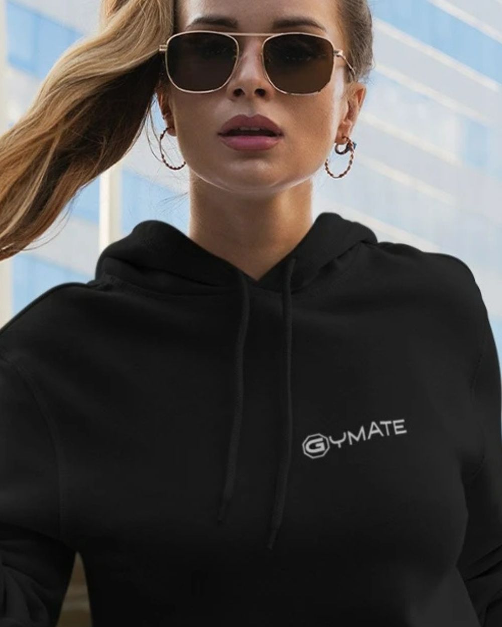 black womens designer hoodie with close up of gymate logo on chest