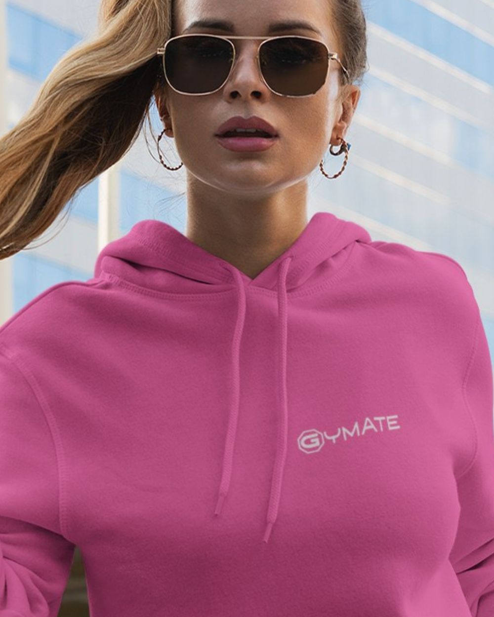 pink womens designer hoodie with close up of gymate logo on chest