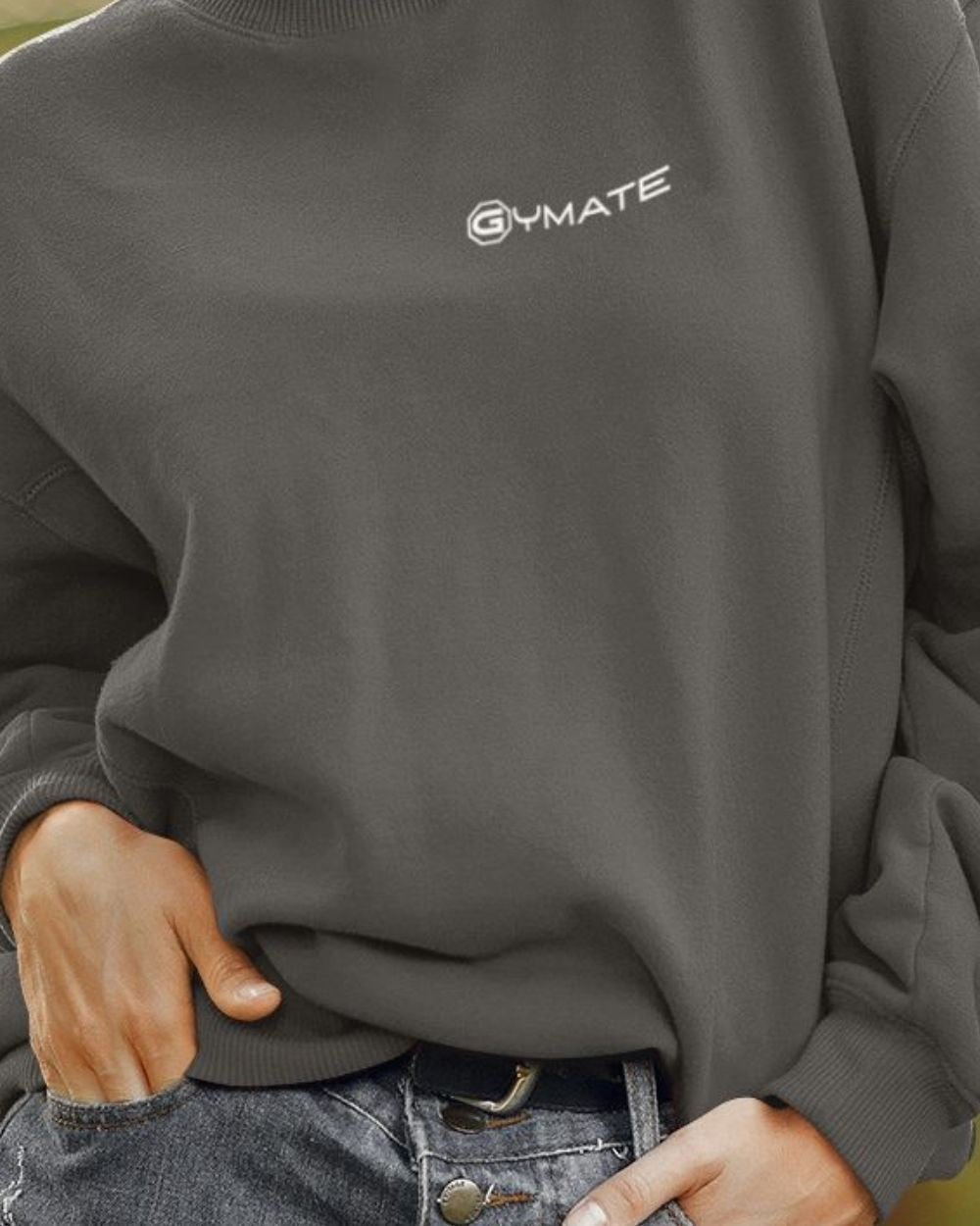 dark grey womens design sweatshirt close up showing logo cuffs and hem