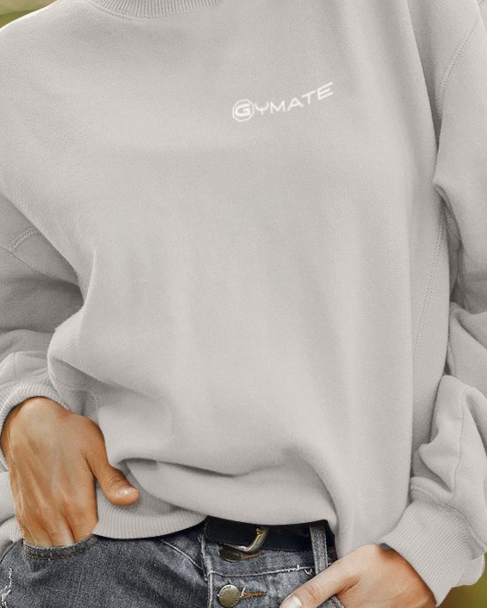 silver grey womens design sweatshirt close up showing logo cuffs and hem